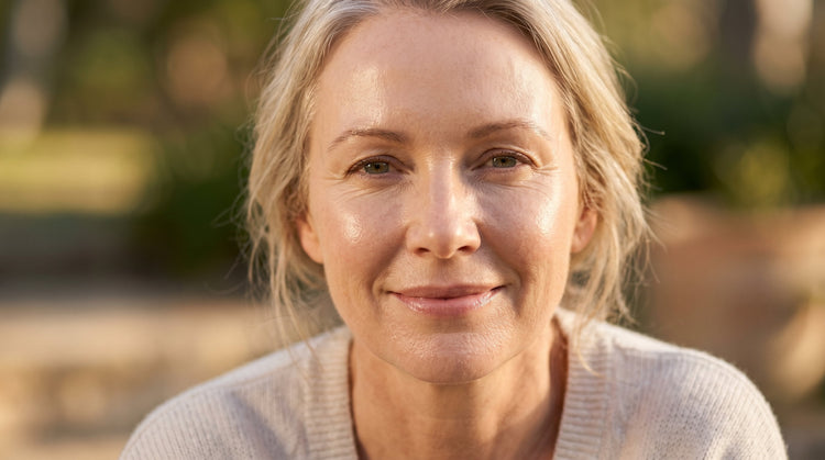 51-year-old Pacific Islander Australian woman with very fair skin and plus-size figure, close-up portrait in warm natural light showing healthy dewy skin texture