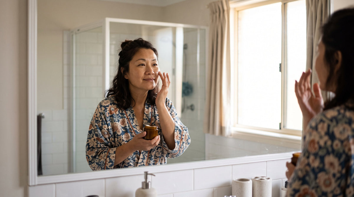 Woman applying moisturiser as part of her morning skincare routine